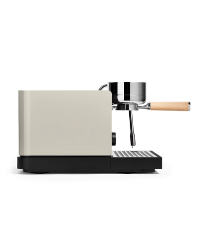 Fellow Espresso series 1 espresso machine in profile view with a sleek design and wooden handle.